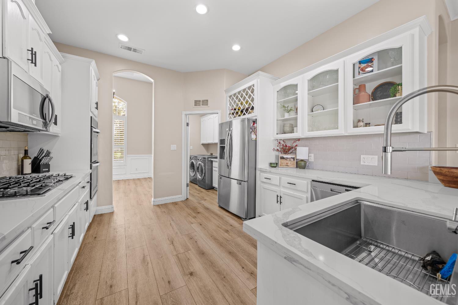 Updated kitchen with quartz countertops and stainless appliances in Shiloh Estates home