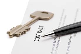 Homebuyer signing a purchase agreement with earnest money check in Minnesota