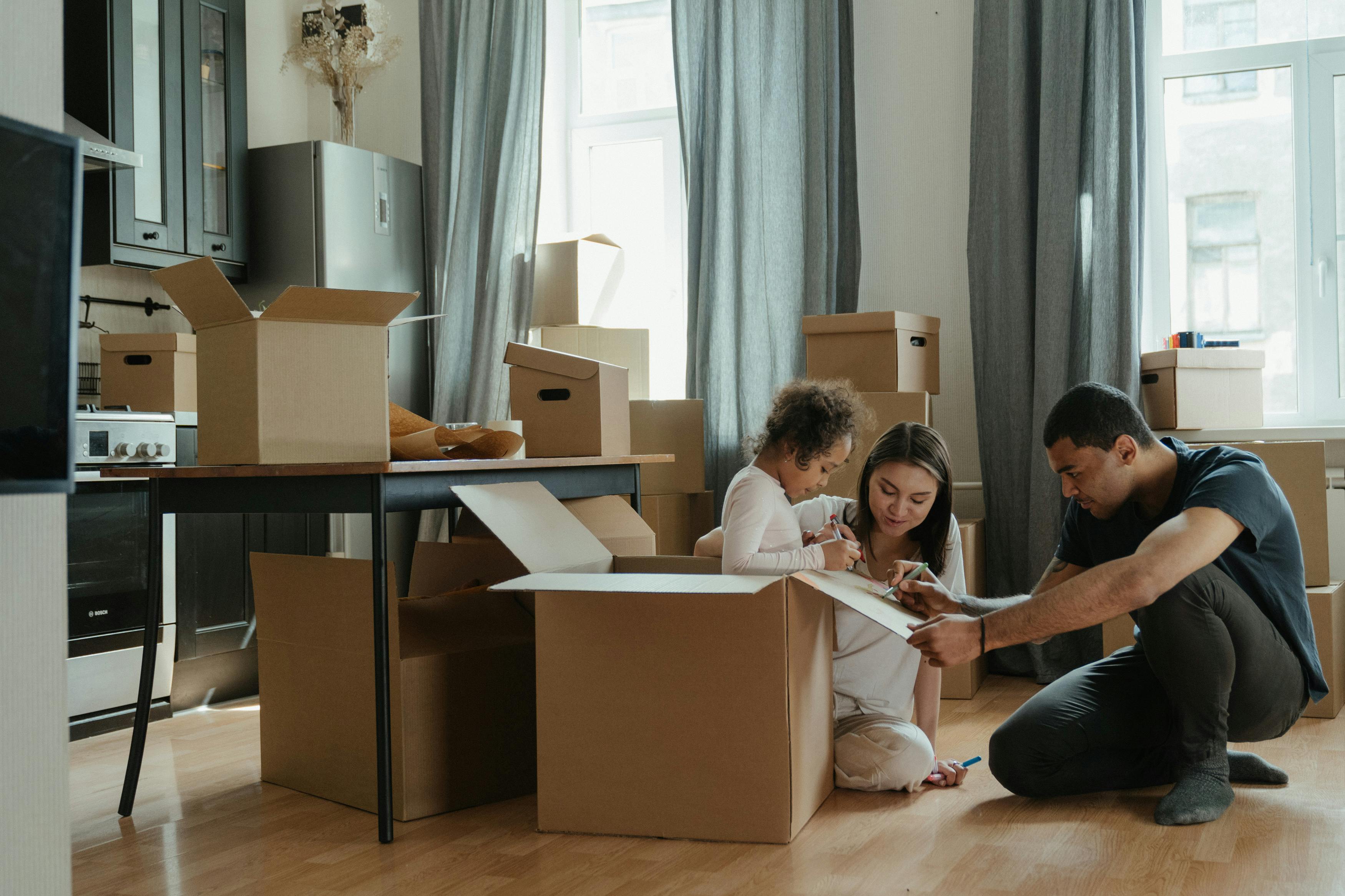 Family in house with moving boxes