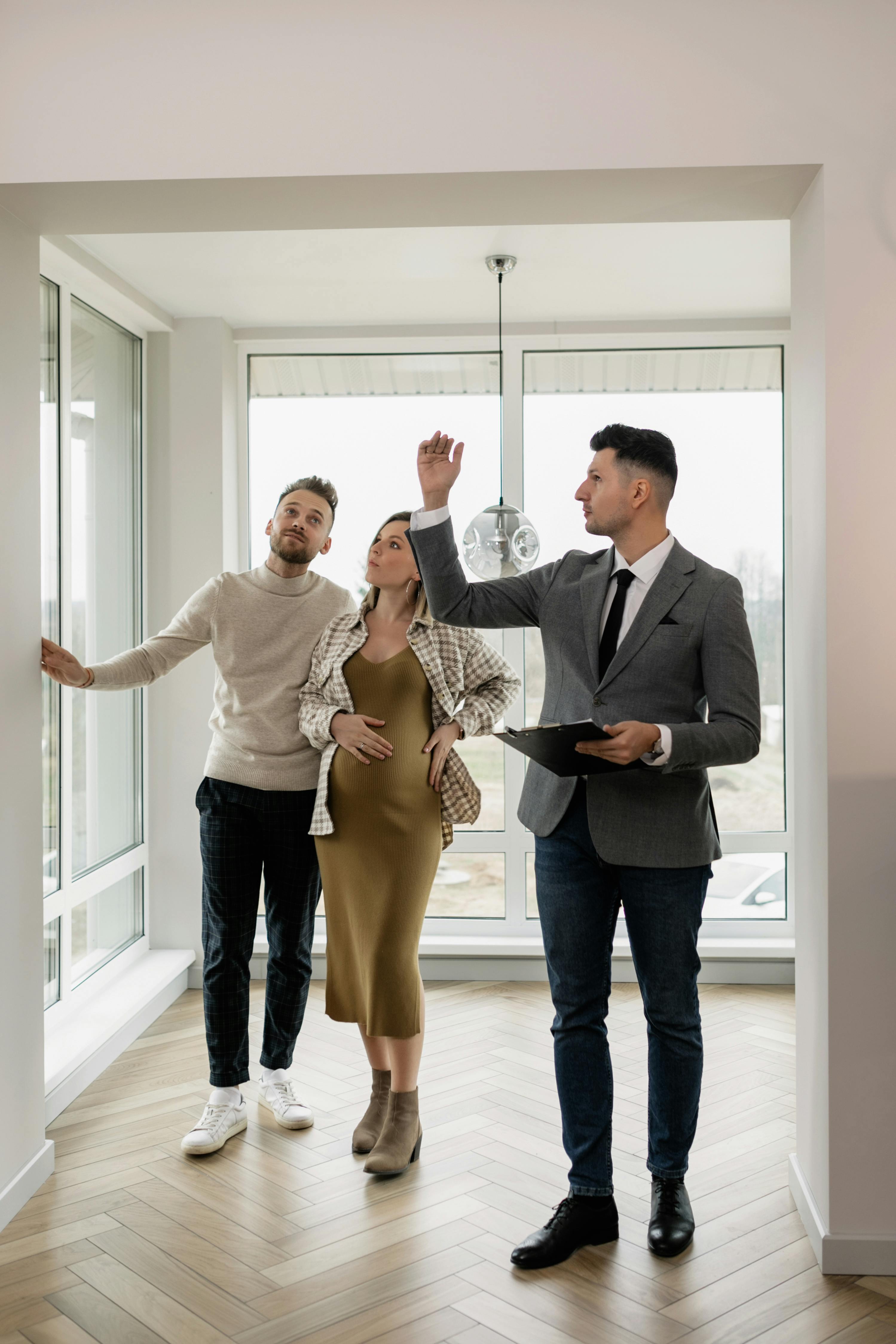 Agent showing couple a home