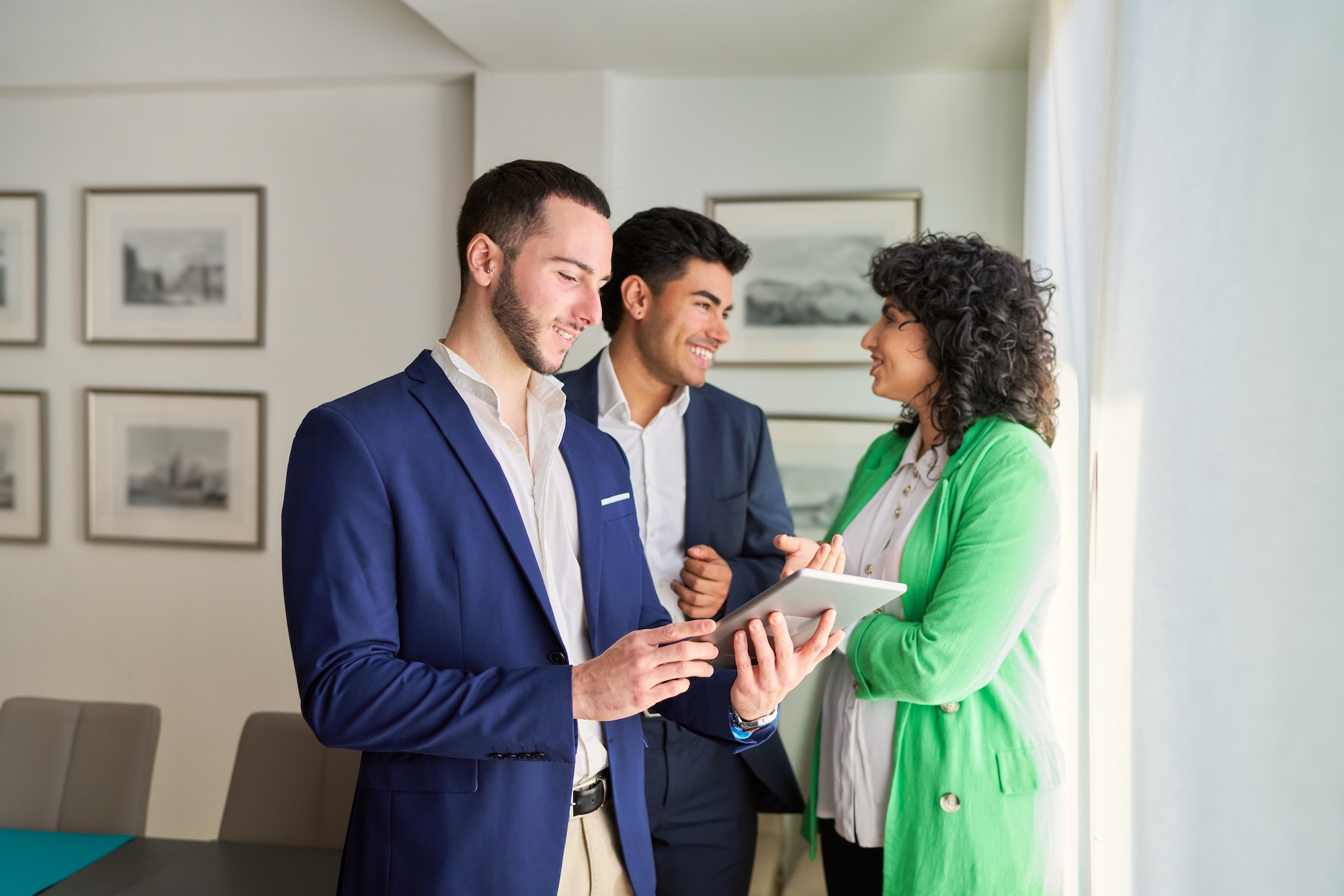 Couple looks at a new home with a real estate agent.
