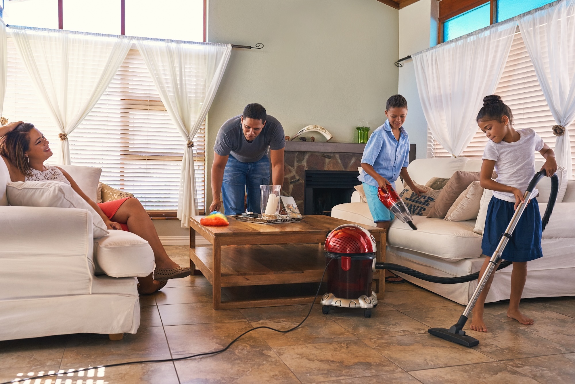 A family deep-cleaning their home.