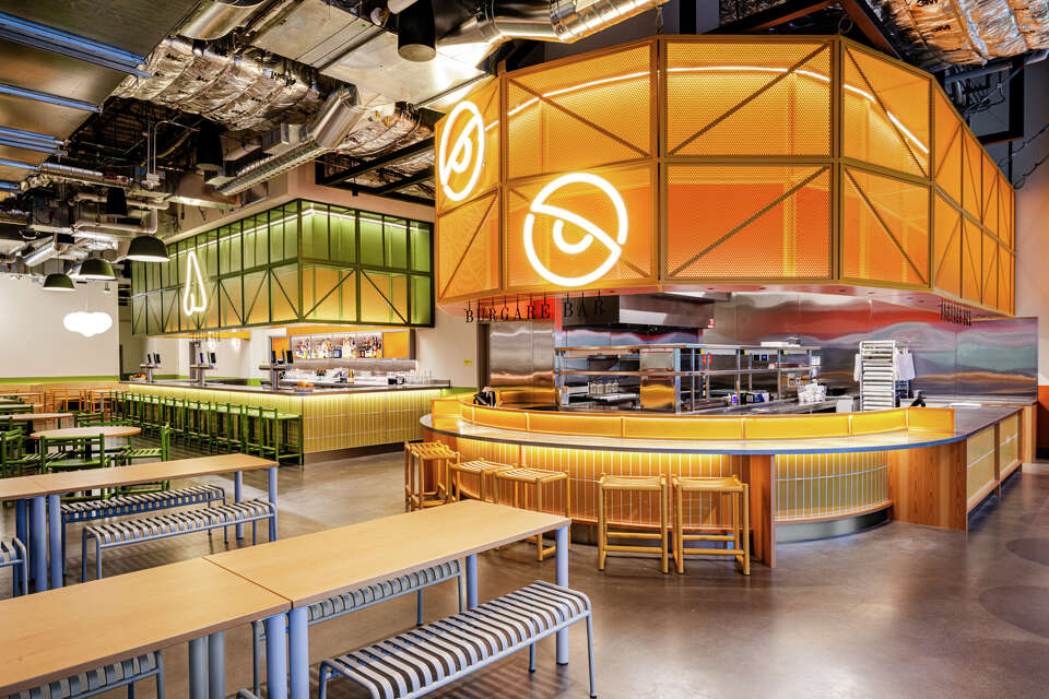 Modern and spacious restaurant interior with communal tables and a vibrant counter area, illustrating the contemporary dining experience expected from a stand-alone IKEA restaurant in Chantilly, Northern Virginia.