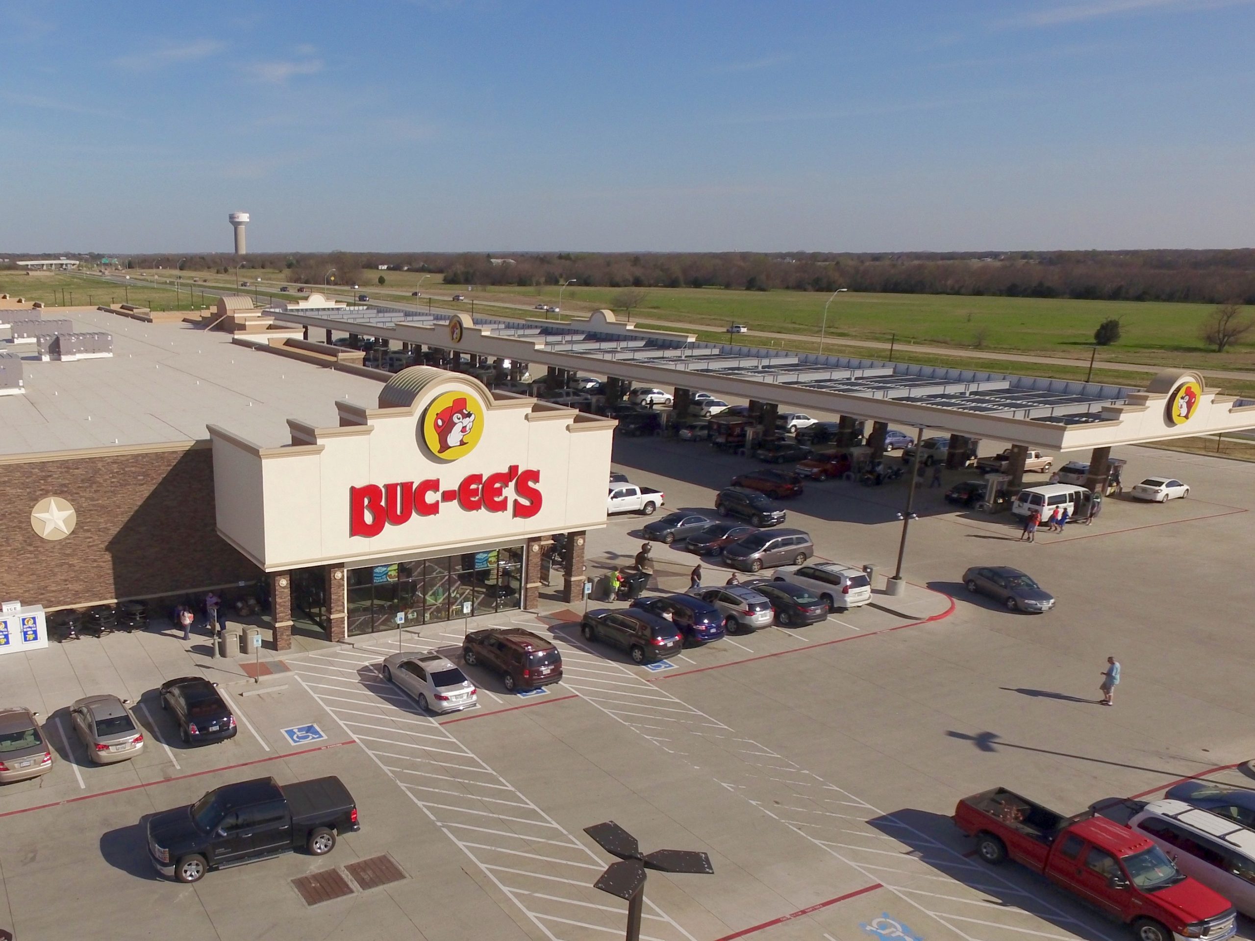 The iconic Buc-ee's in Terrell, TX, a popular road trip destination off I-20 with a sprawling parking lot and endless fuel pumps.