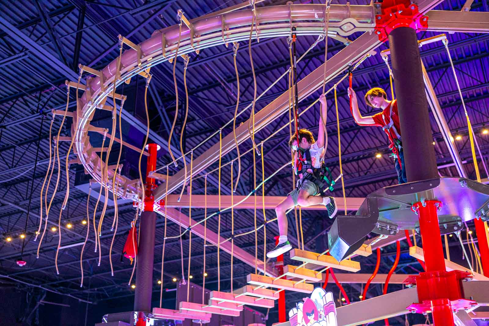 A view of the high-ropes course suspended over the extensive arcade game floor at PINSTACK, a new destination for family fun in Northern Virginia.