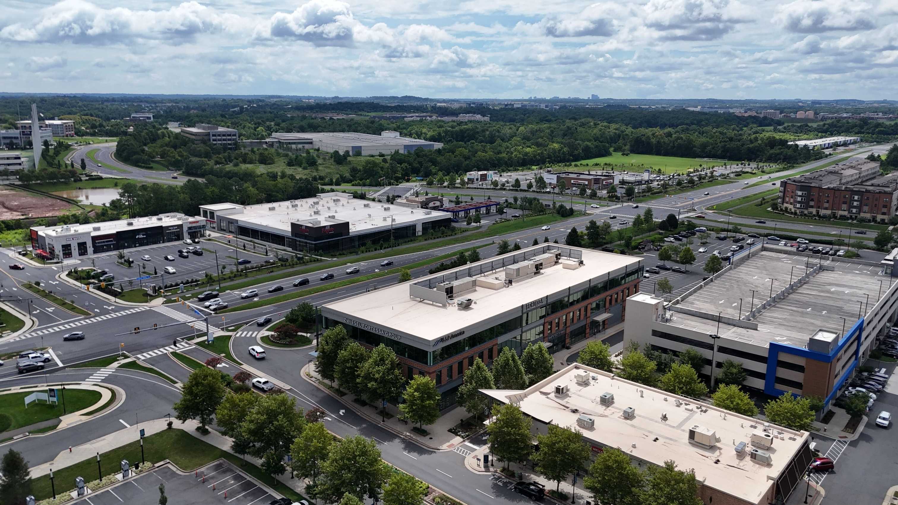 Aerial view of commercial buildings and roads at One Loudoun in Ashburn, Virginia