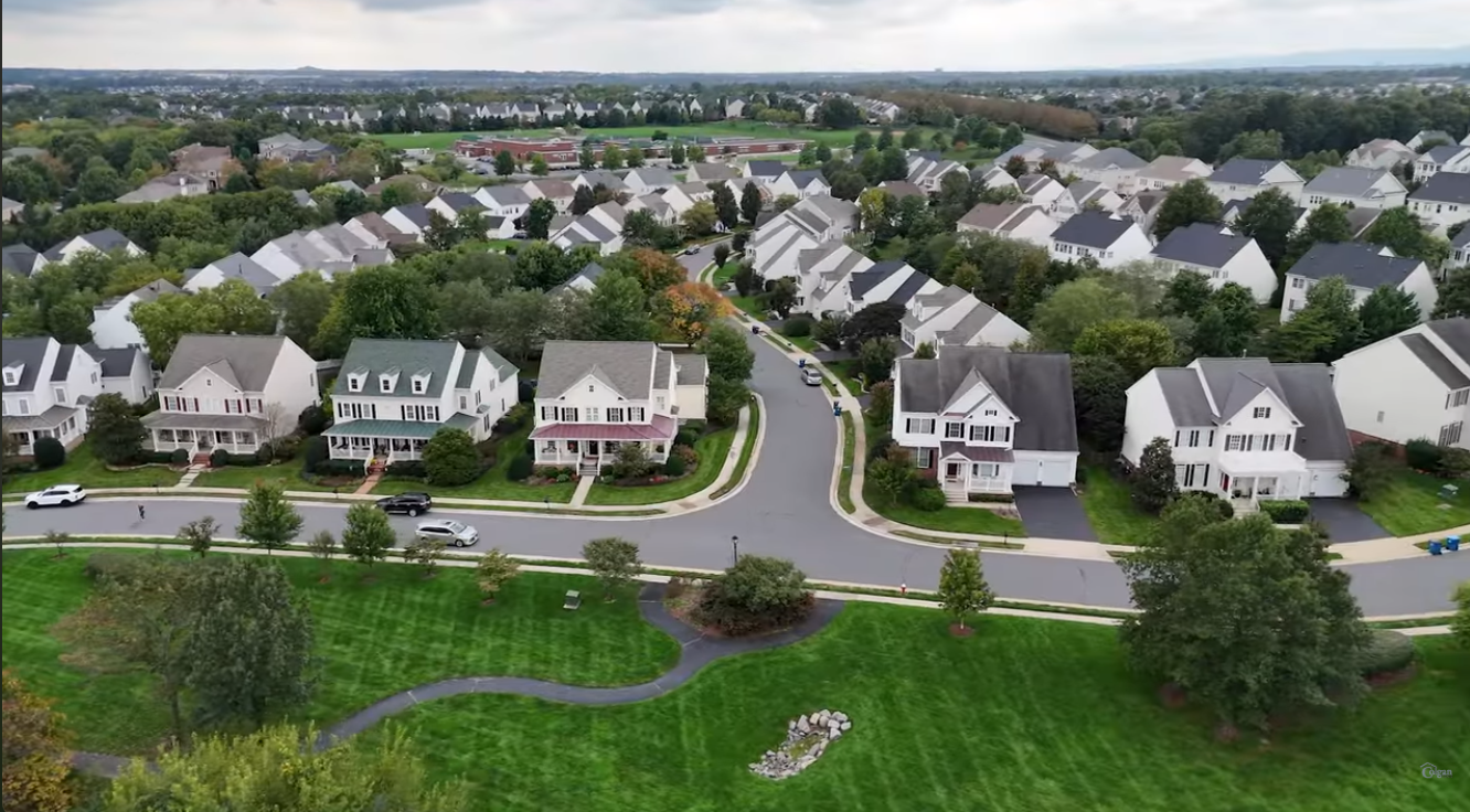 Detached homes and open green space in Brambleton, Virginia