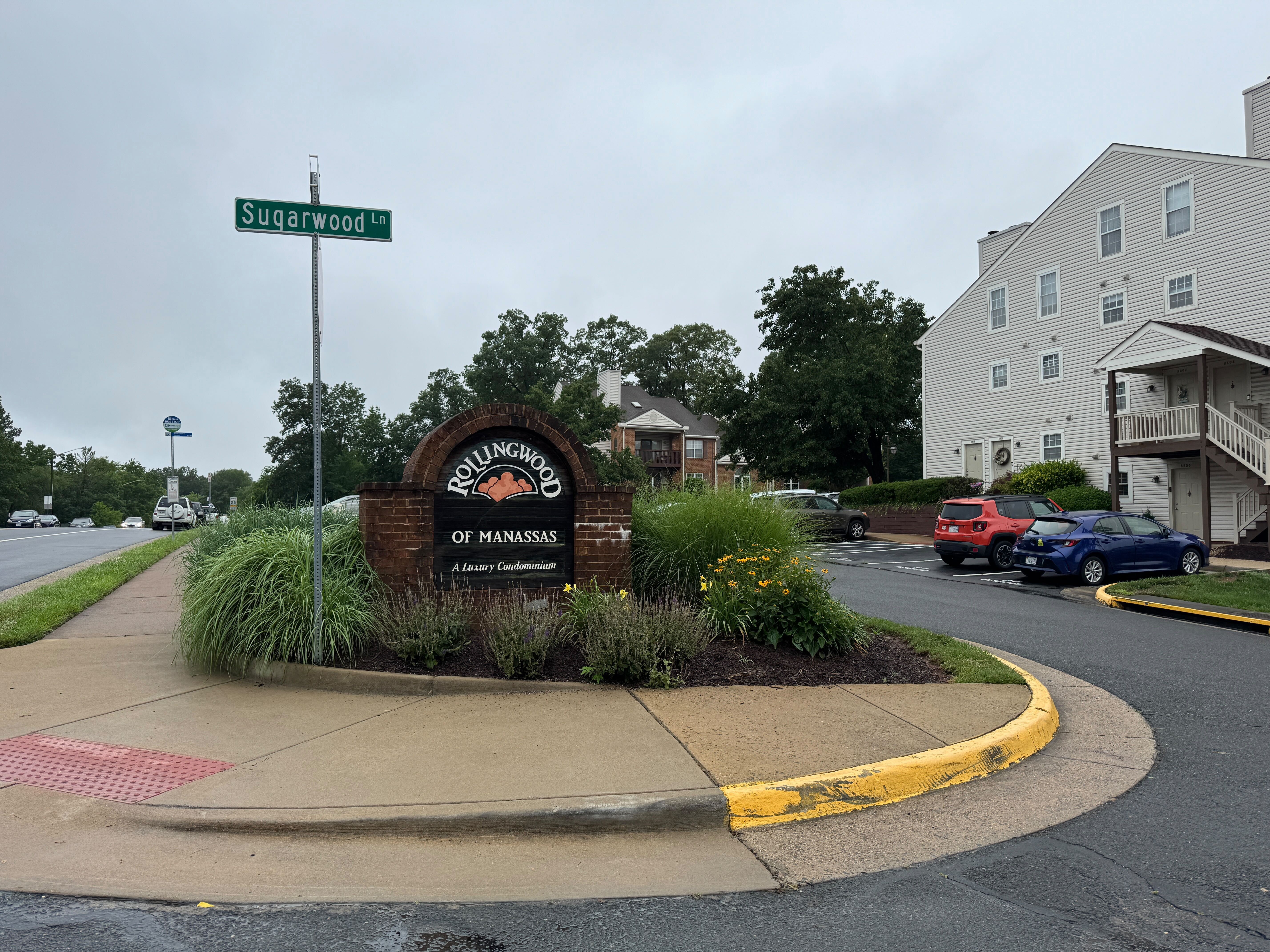 The welcoming entrance to Rollingwood of Manassas, a well-maintained luxury condominium community offering a fantastic lifestyle in a prime location.