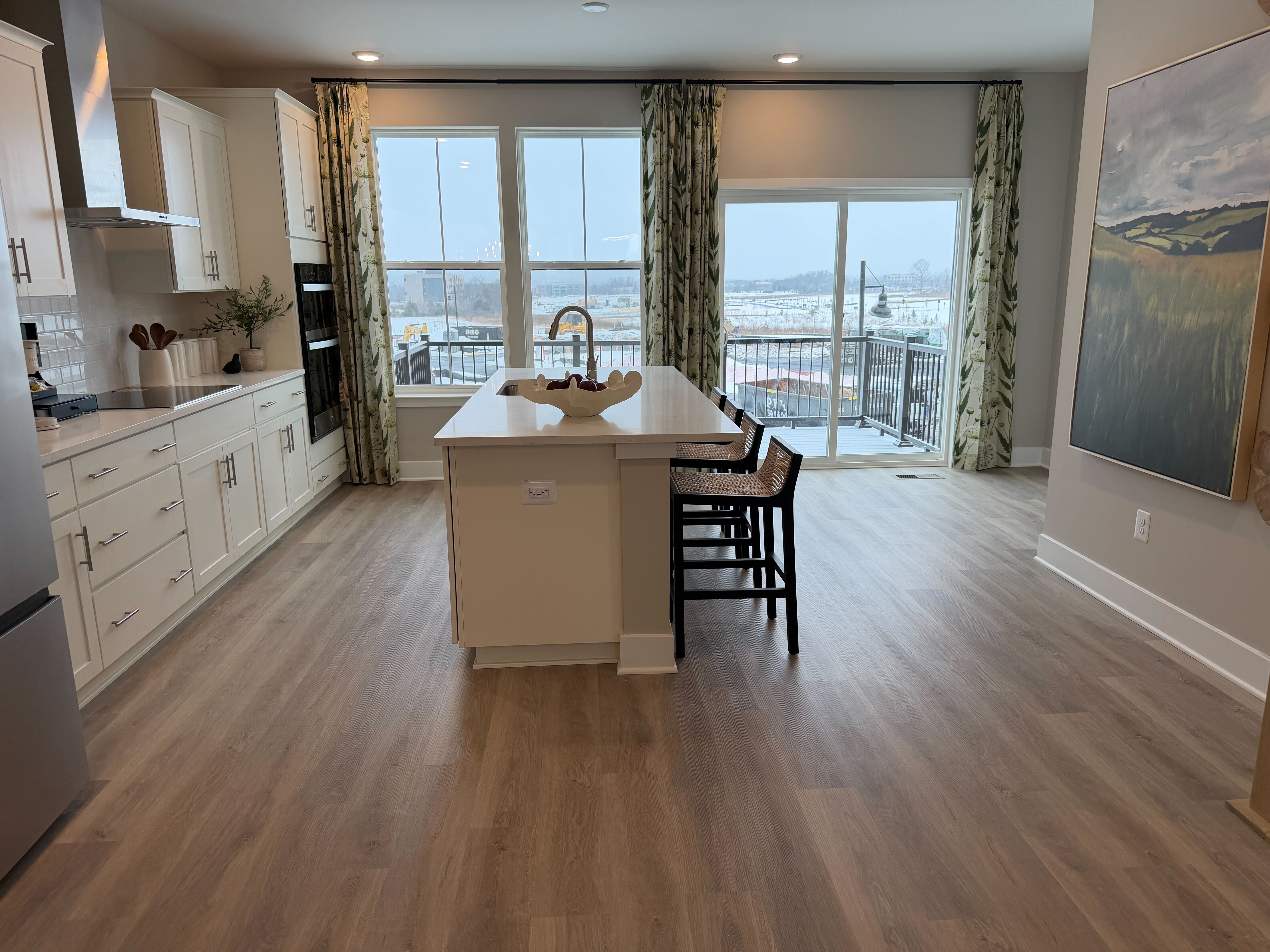Kitchen with island in a D.R. Horton Innovation model home in the Manassas area