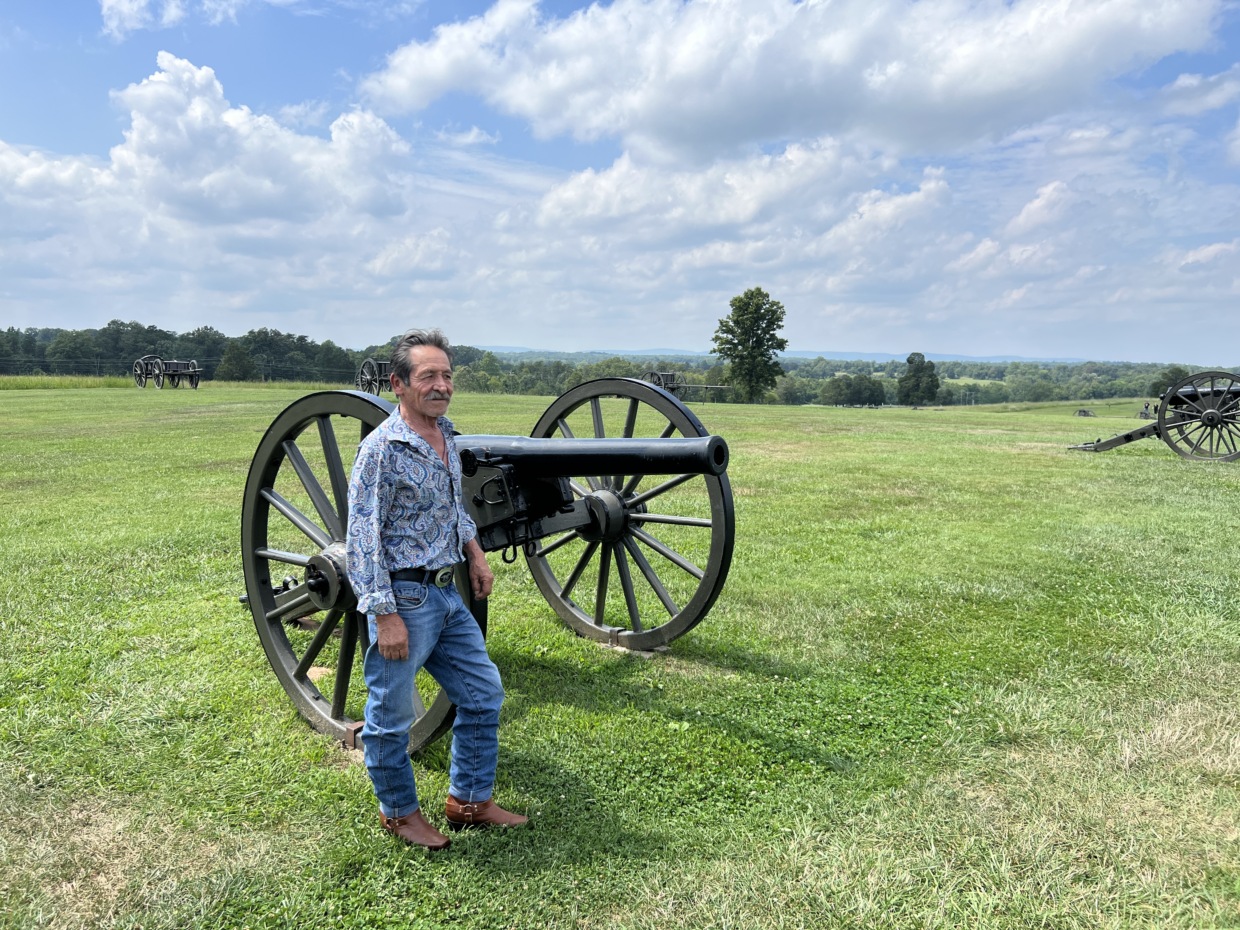 A resident enjoying the wide-open green space at Manassas National Battlefield Park, a major recreational amenity for nearby homes.