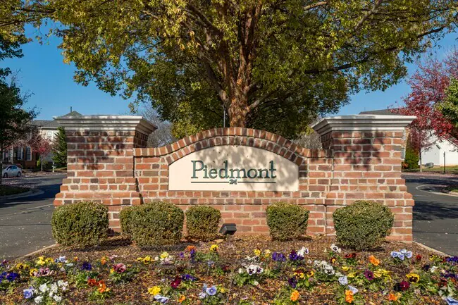 Entrance sign of Piedmont, a gated golf community in Haymarket, VA, popular among families relocating to Northern Virginia for great schools and amenities.