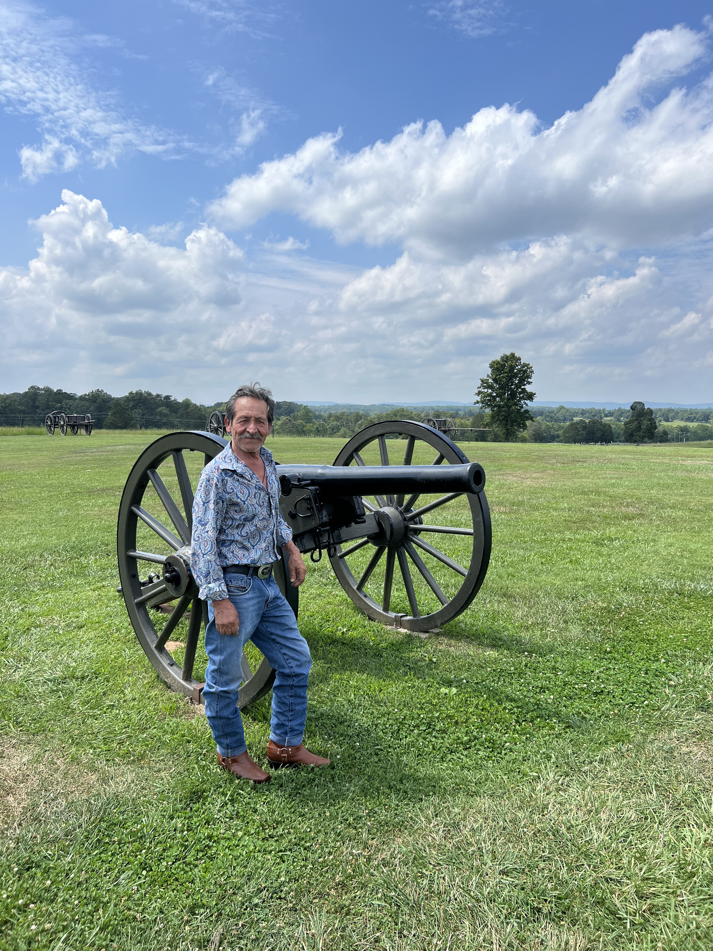 A resident enjoying the wide-open green space at Manassas National Battlefield Park, a major recreational amenity for nearby homes.