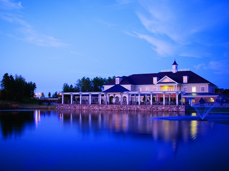 Dominion Valley Country Club entrance and golf course in Haymarket, Virginia, showcasing a luxury gated community lifestyle.