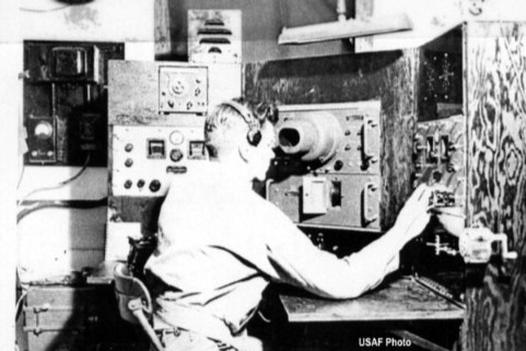 A historic photo of a U.S. Army signals analyst at his monitoring station, representing the top-secret work of the codebreakers at Vint Hill during WWII.