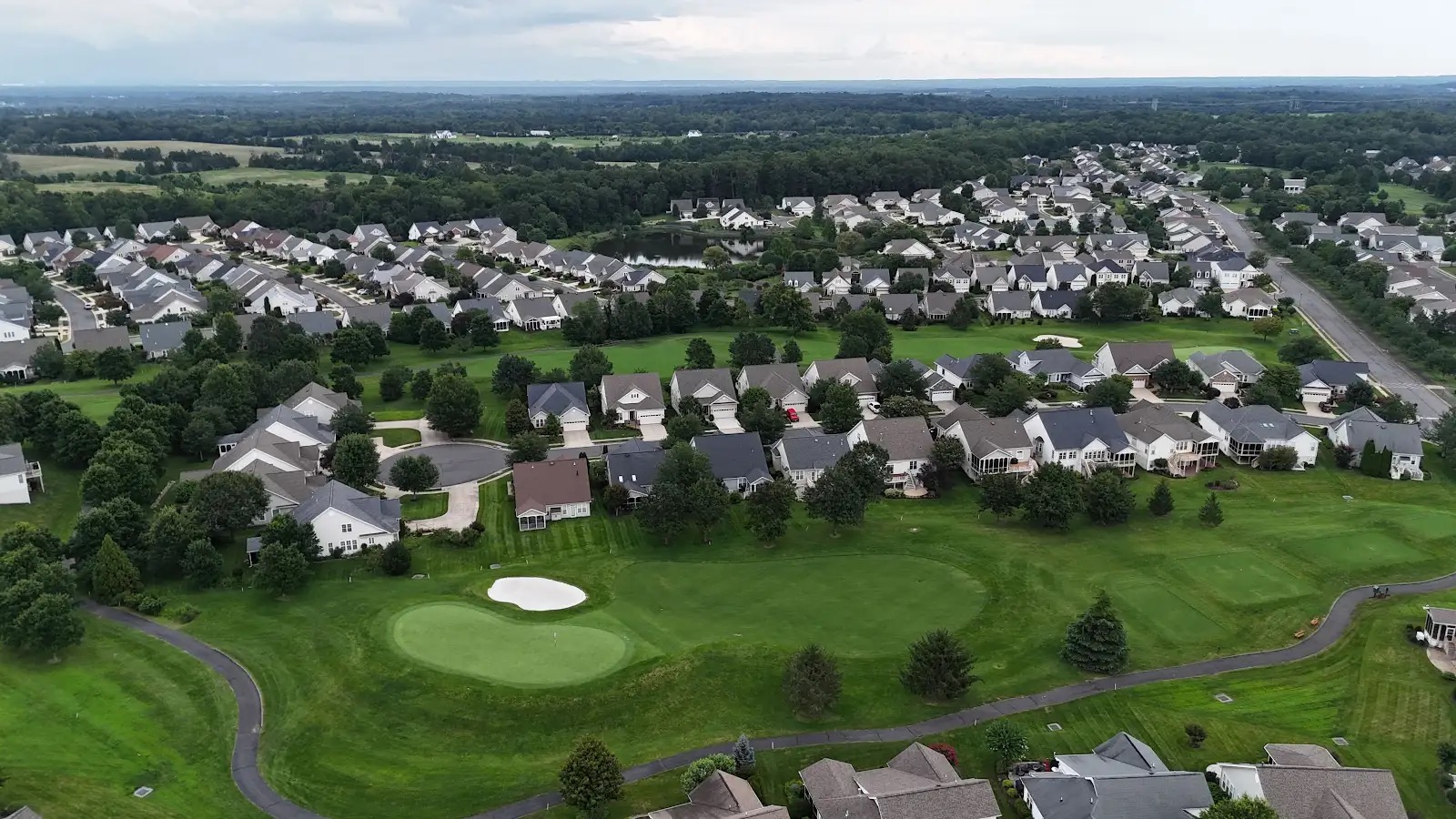 Homes bordering a golf green and fairway in Heritage Hunt, Gainesville, Virginia