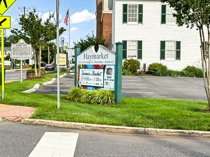 Welcome sign and historic building in downtown Haymarket, Virginia