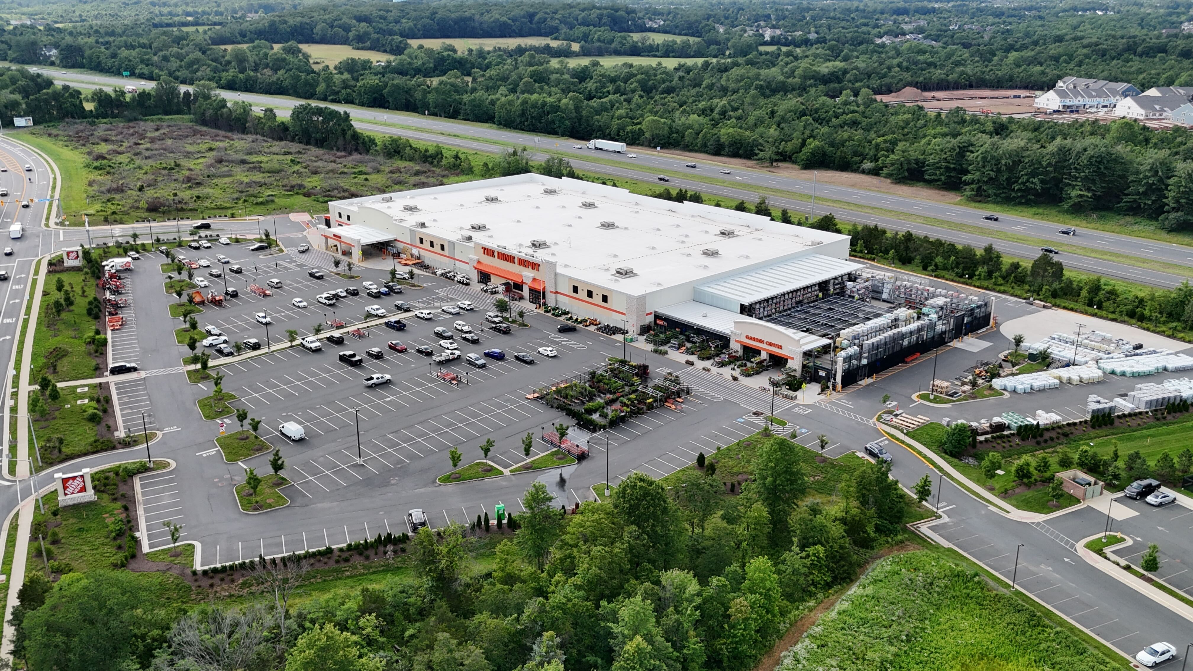 Aerial view of the Home Depot store in Haymarket, Virginia, showing the building, parking lot, and the adjacent Interstate 66