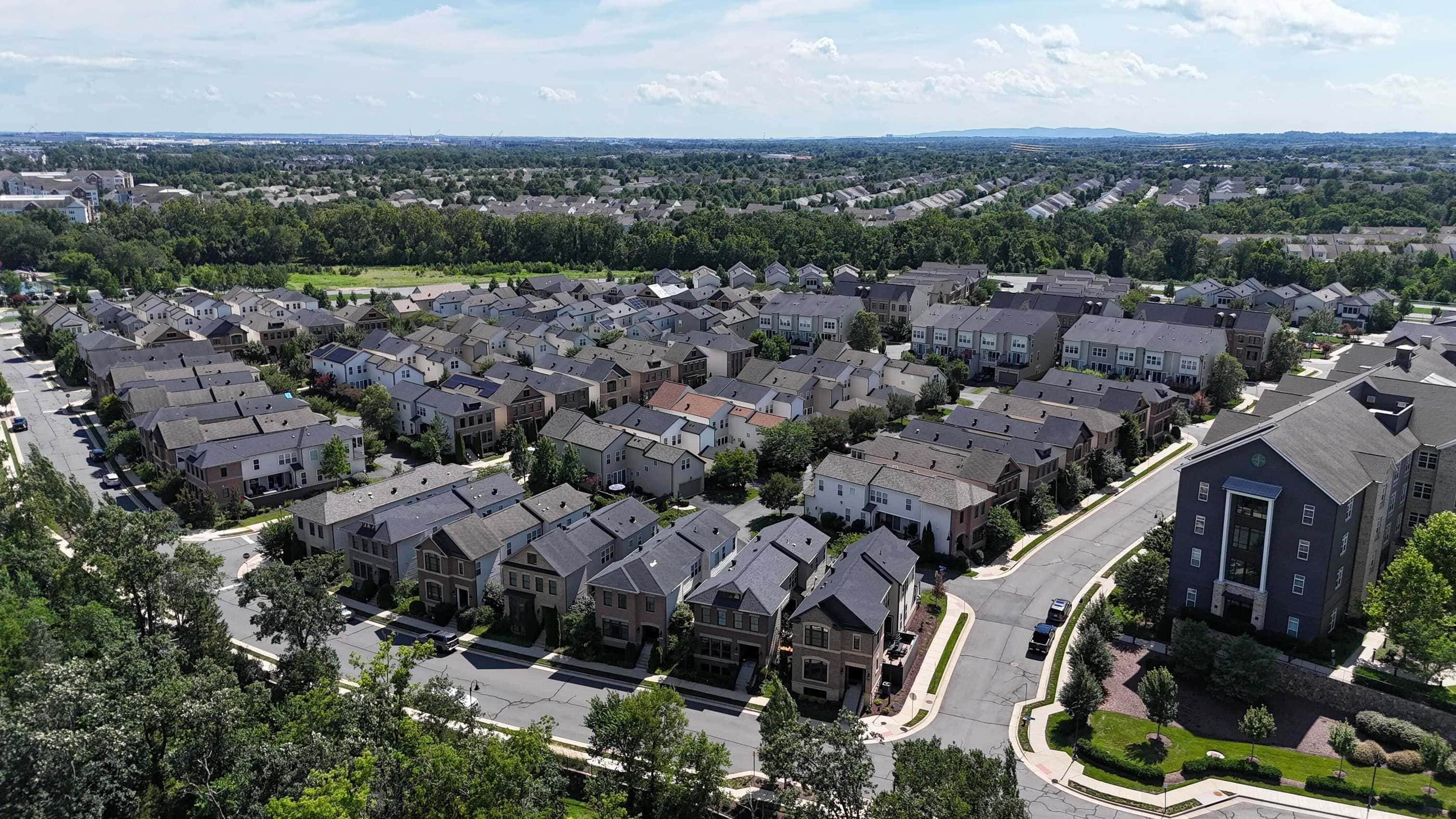 Aerial view of homes and tree-lined streets at One Loudoun in Ashburn, Northern Virginia