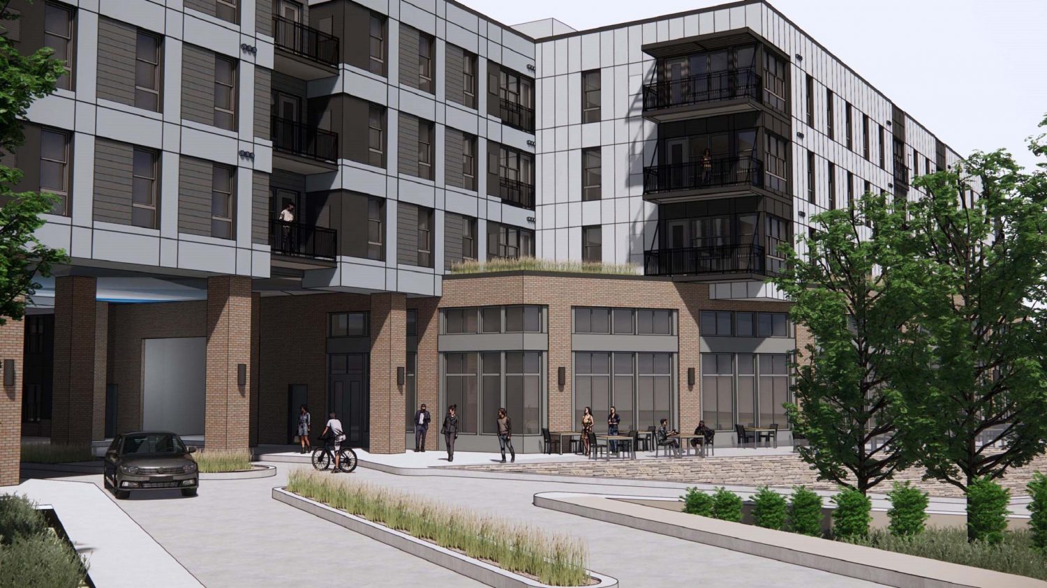 A street-level rendering of Building C at the George Mason University Prince William Campus, showing the building entrance, outdoor seating, and pedestrian areas.