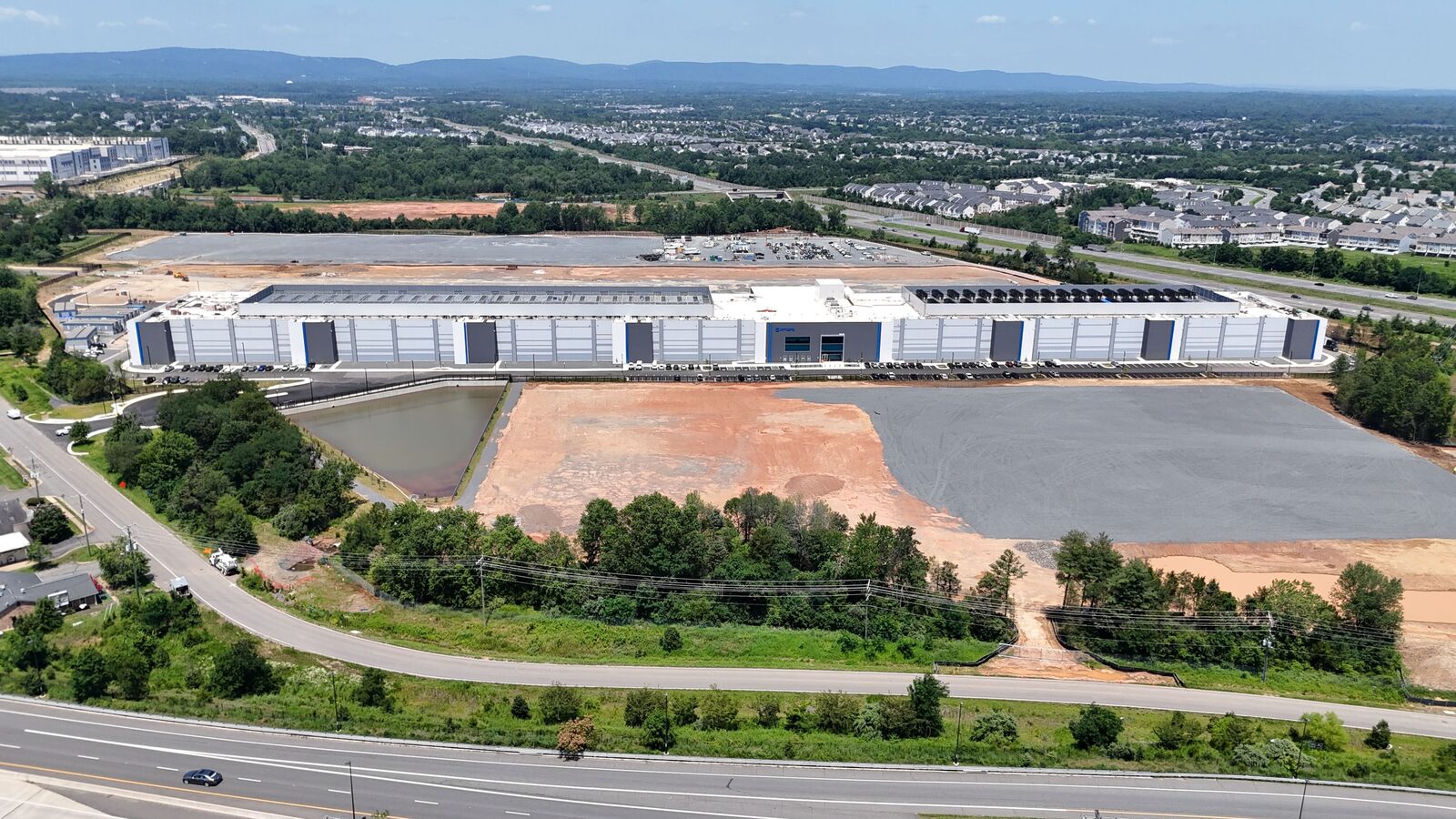 Aerial view of a Northern Virginia data center near residential neighborhoods in Gainesville, Virginia