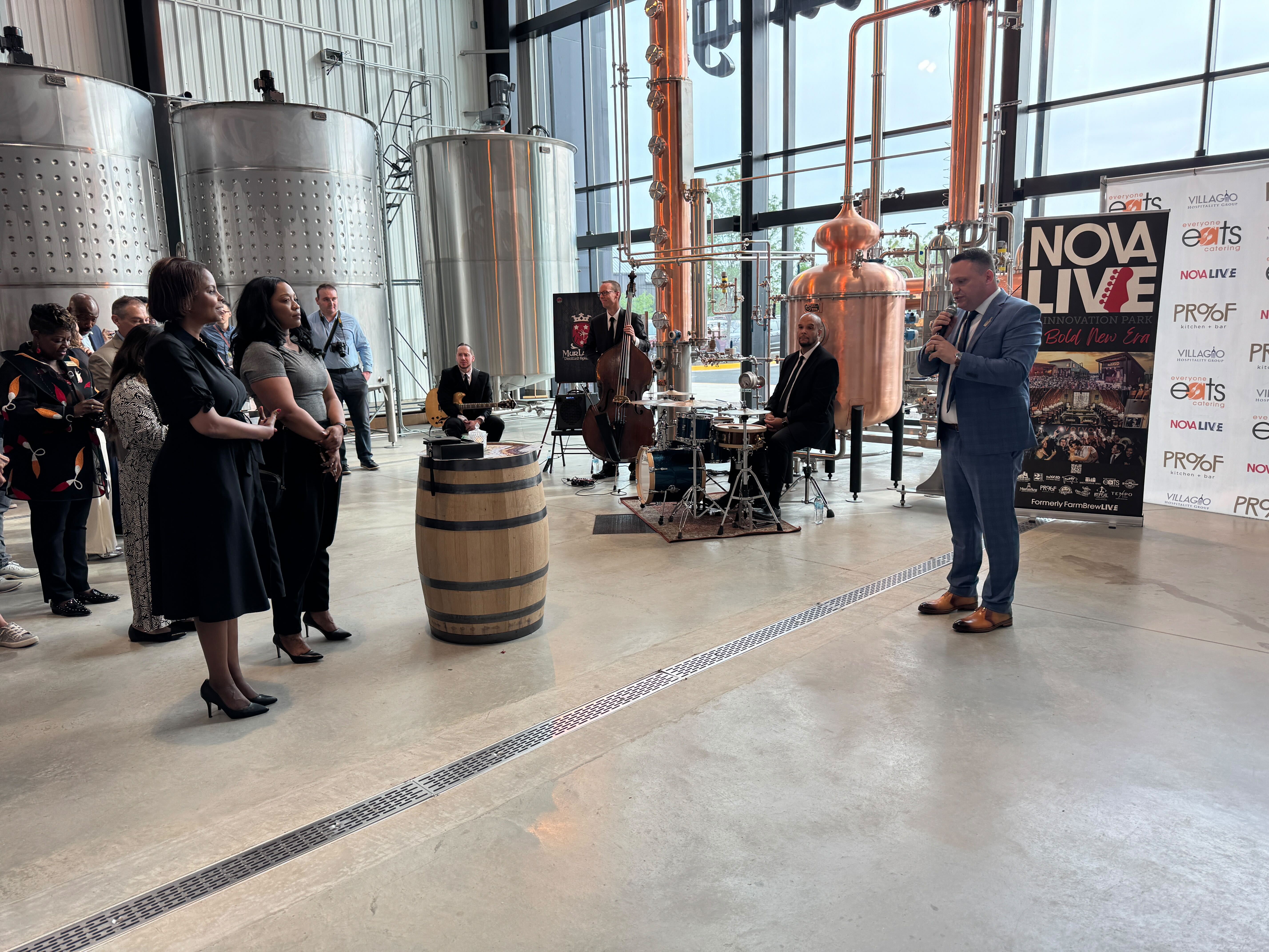 Modern brewery-style venue with outdoor seating and lighting – representative of Nova Live atmosphere