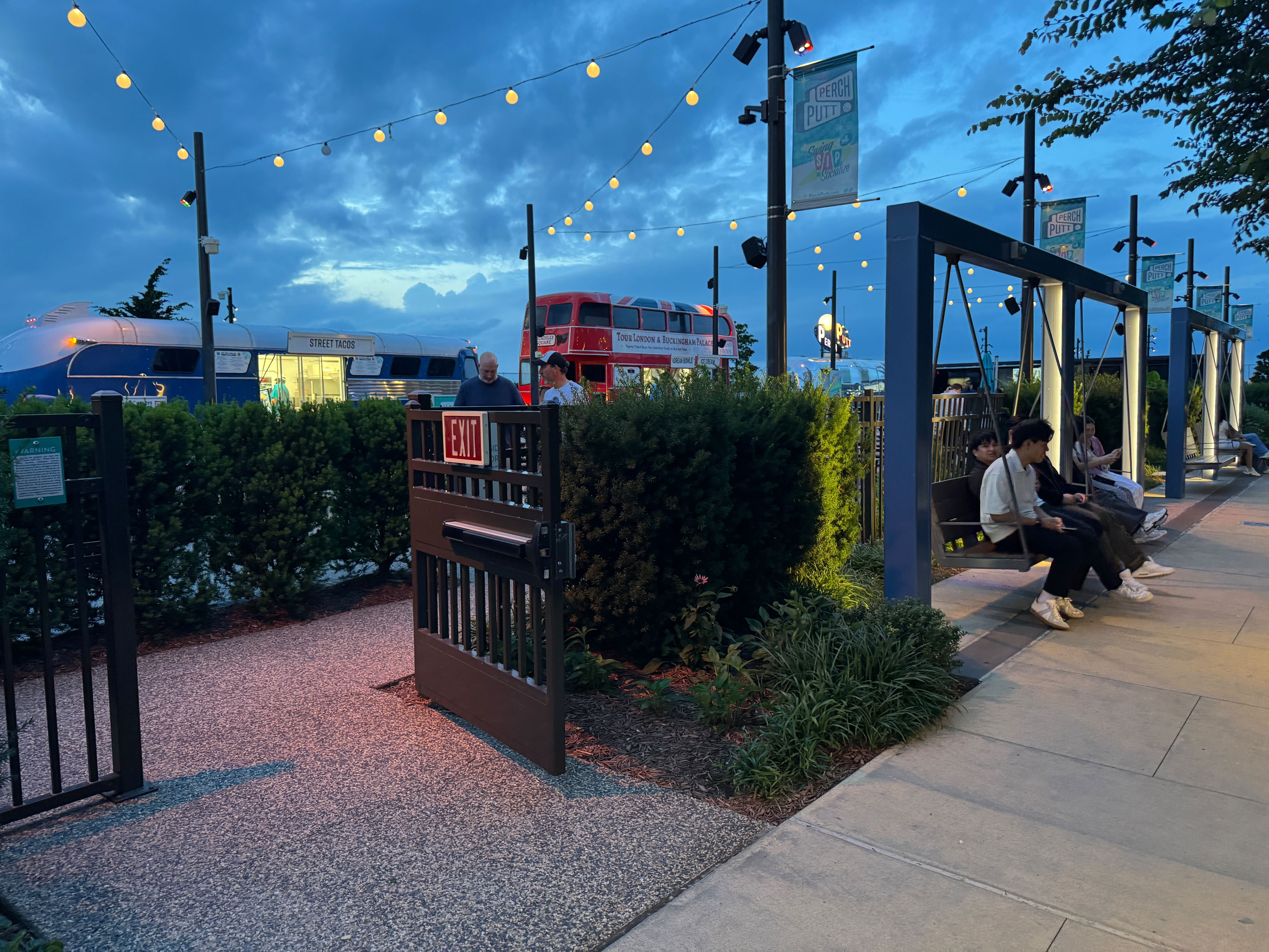 The unique food truck court and lounge area at The Perch, a one-of-a-kind dining and entertainment amenity for residents in the vibrant Tysons, VA community.