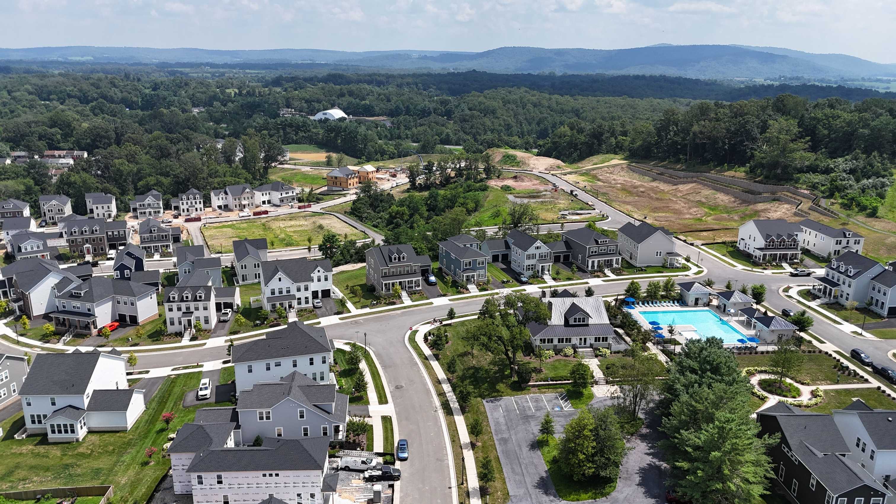 Aerial view of homes, green space and community pool at Heritage at Marshall, Virginia