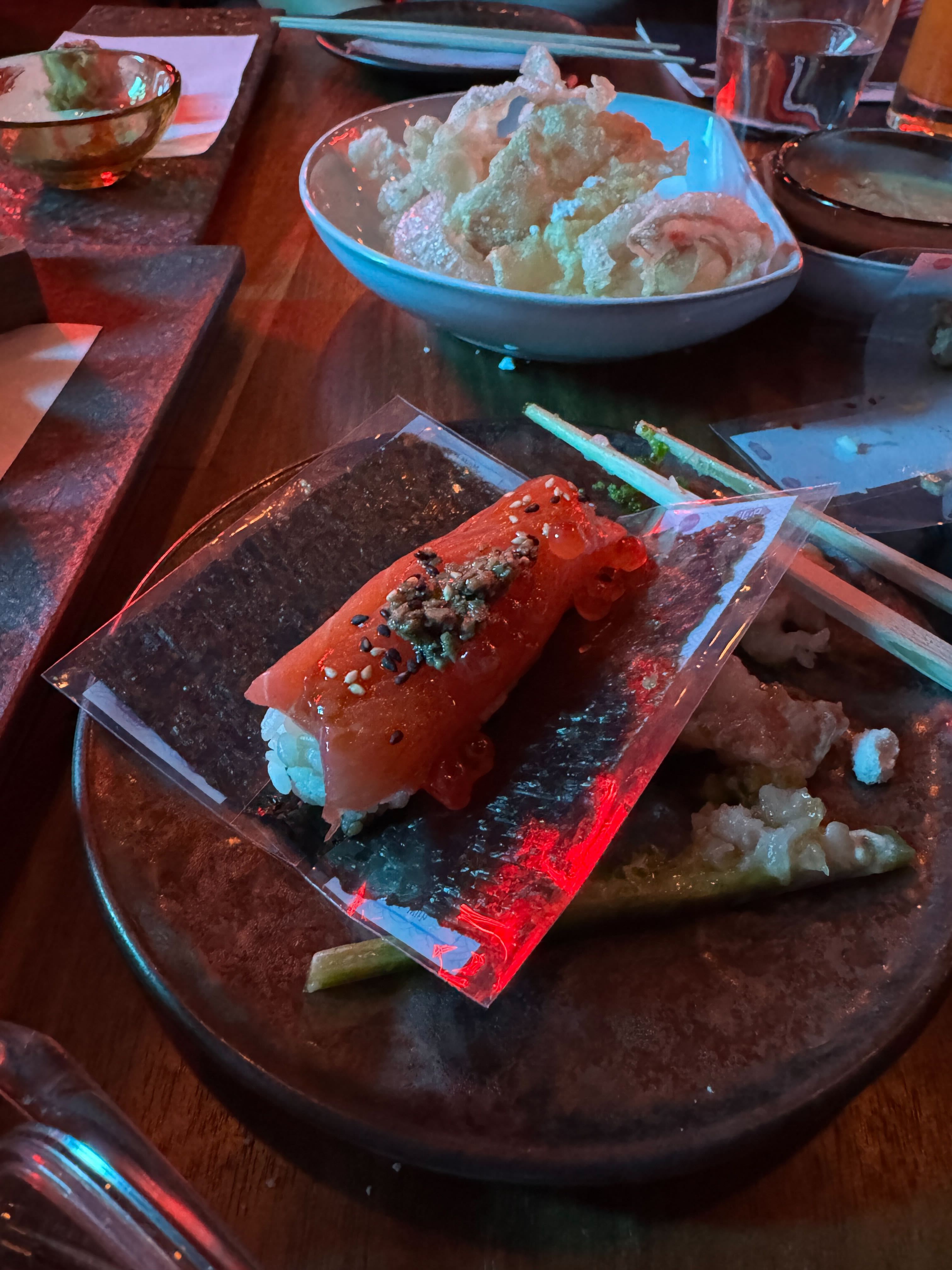 The art of cuisine at Naisō Room, the exclusive restaurant at The Verse, where even a single piece of salmon nigiri is presented as a masterpiece.