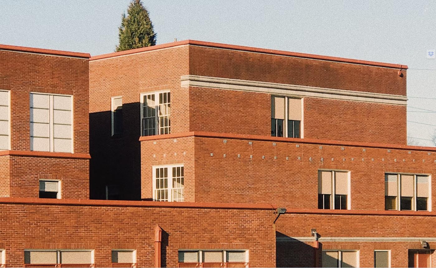 Brick school building exterior representing Huntsville, AL area schools