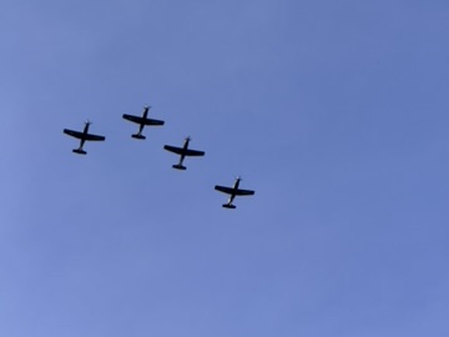 Four aircraft flying in formation over Huntsville, Alabama near Redstone Arsenal