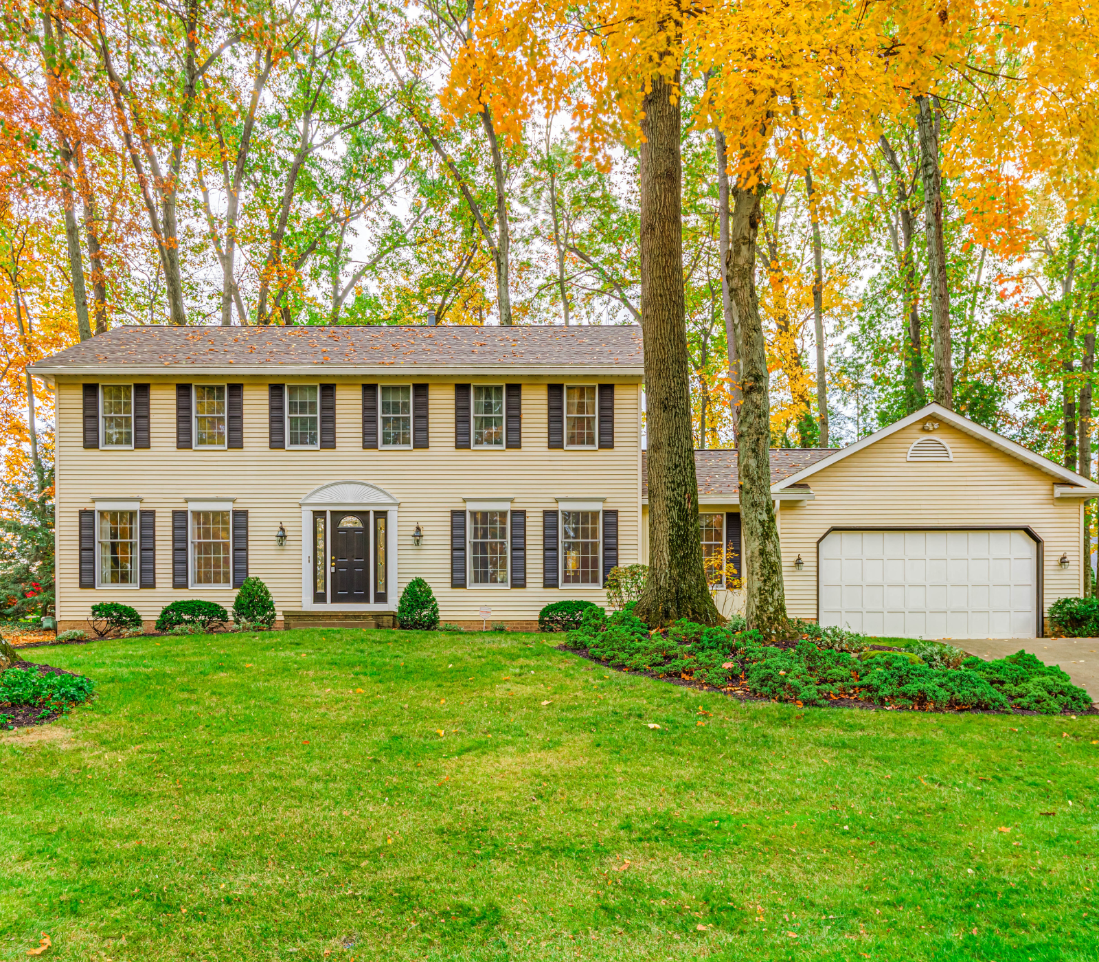 House surrounded by Fall foliage