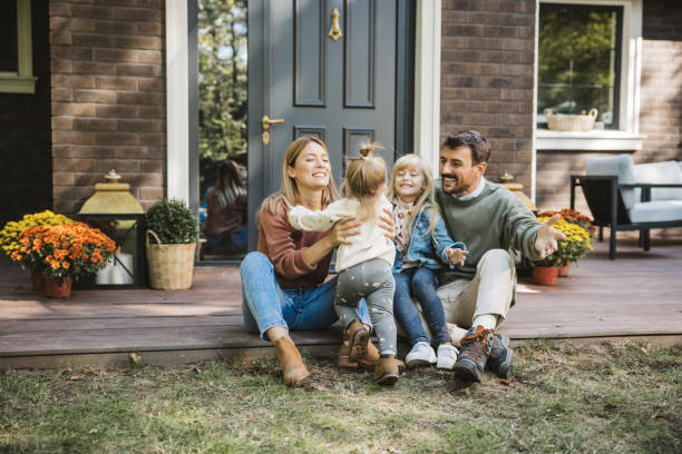 Home buyers touring a house and evaluating layout, light, and livability
