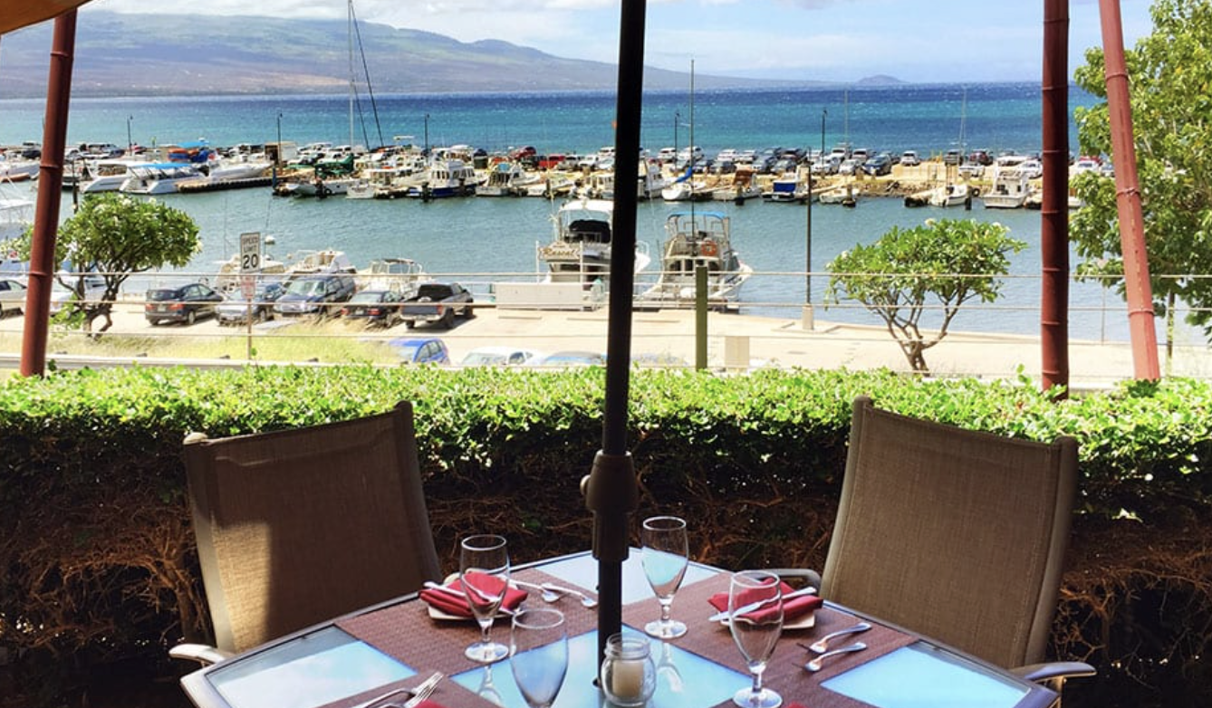 Oceanfront restaurant in Maalaea Maui with outdoor seating and harbor views