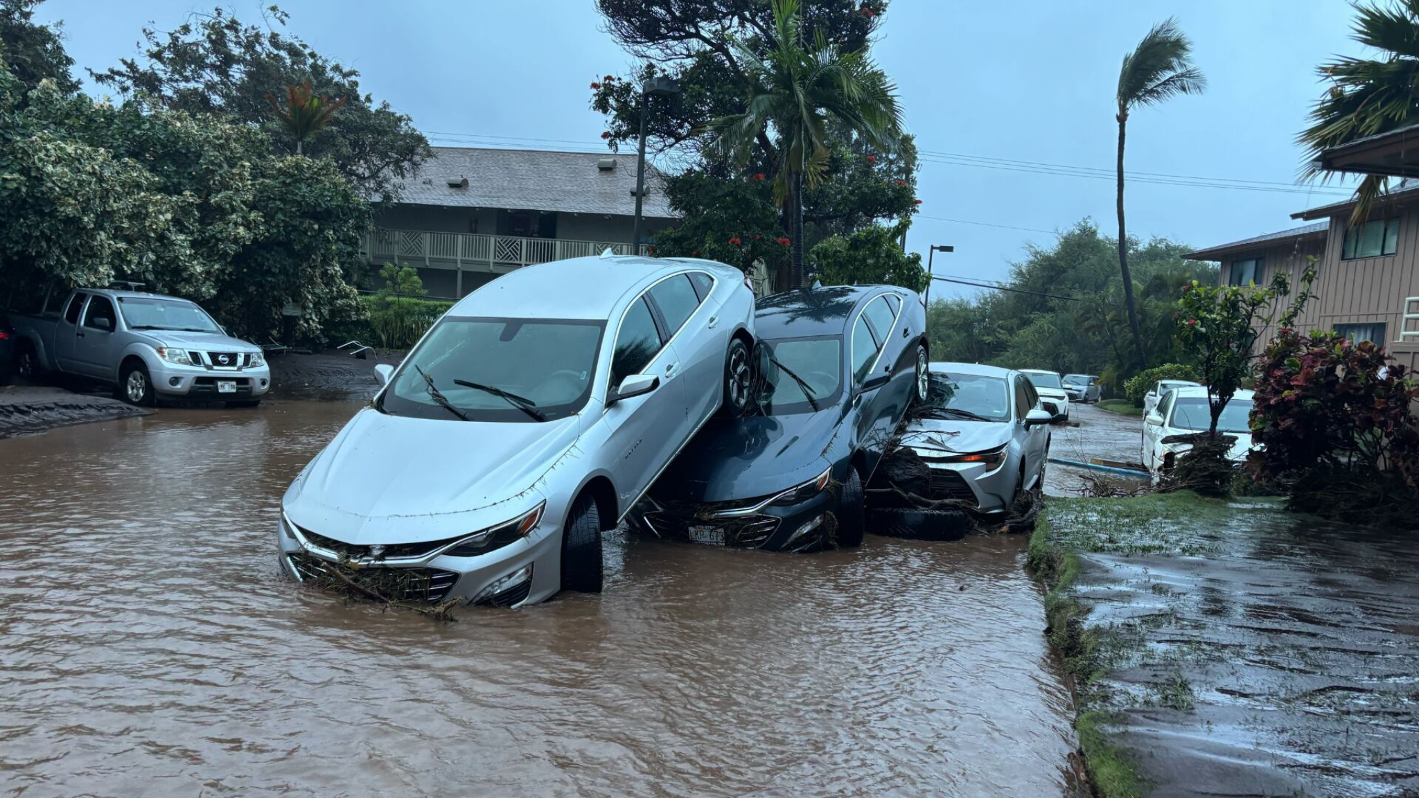 Storm flooding in Kihei Maui showing vehicles impacted by heavy rainfall during March 2026 Kona storm.