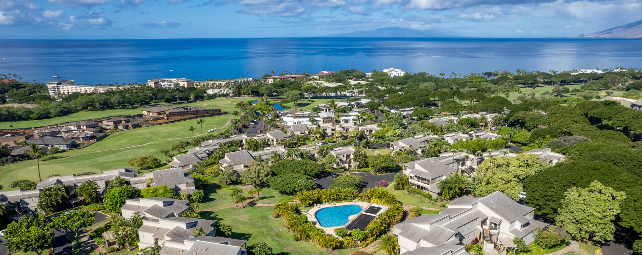 Aerial view of Wailea Ekolu condos overlooking the Wailea Blue Golf Course with ocean views in Wailea Maui.