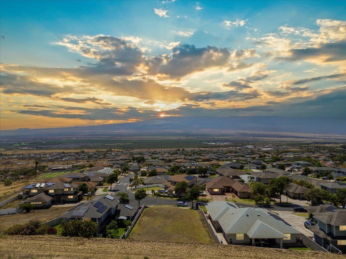 Aerial sunrise over Wailuku nestled below the West Maui Mountains