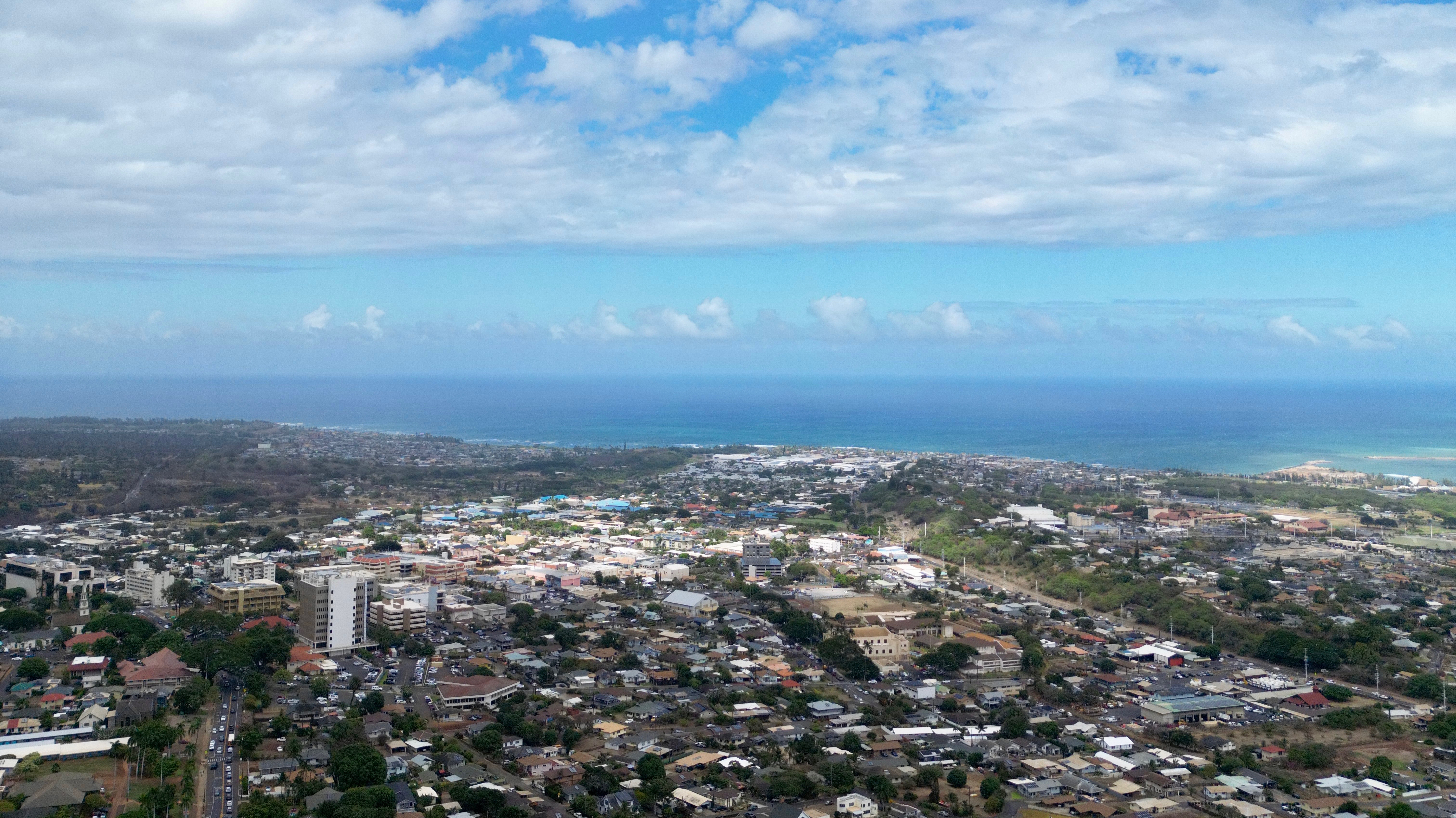 Aerial view of Wailuku town and ʻĪao Valley on Maui with residential homes in the foreground.