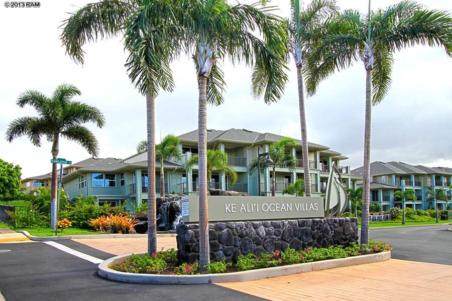 Ke Alii Ocean Villas condominium community in South Kihei, Maui, showcasing upscale residential condos with tropical landscaping, palm trees, spacious residences, and a prime location just across from Kamaole Beach I.