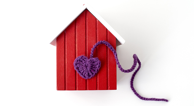 Red Wooden House with a crochet heart