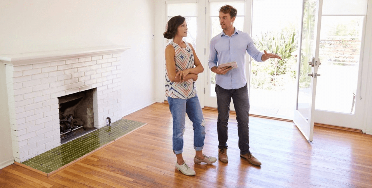 Realtor showing a house to buyers