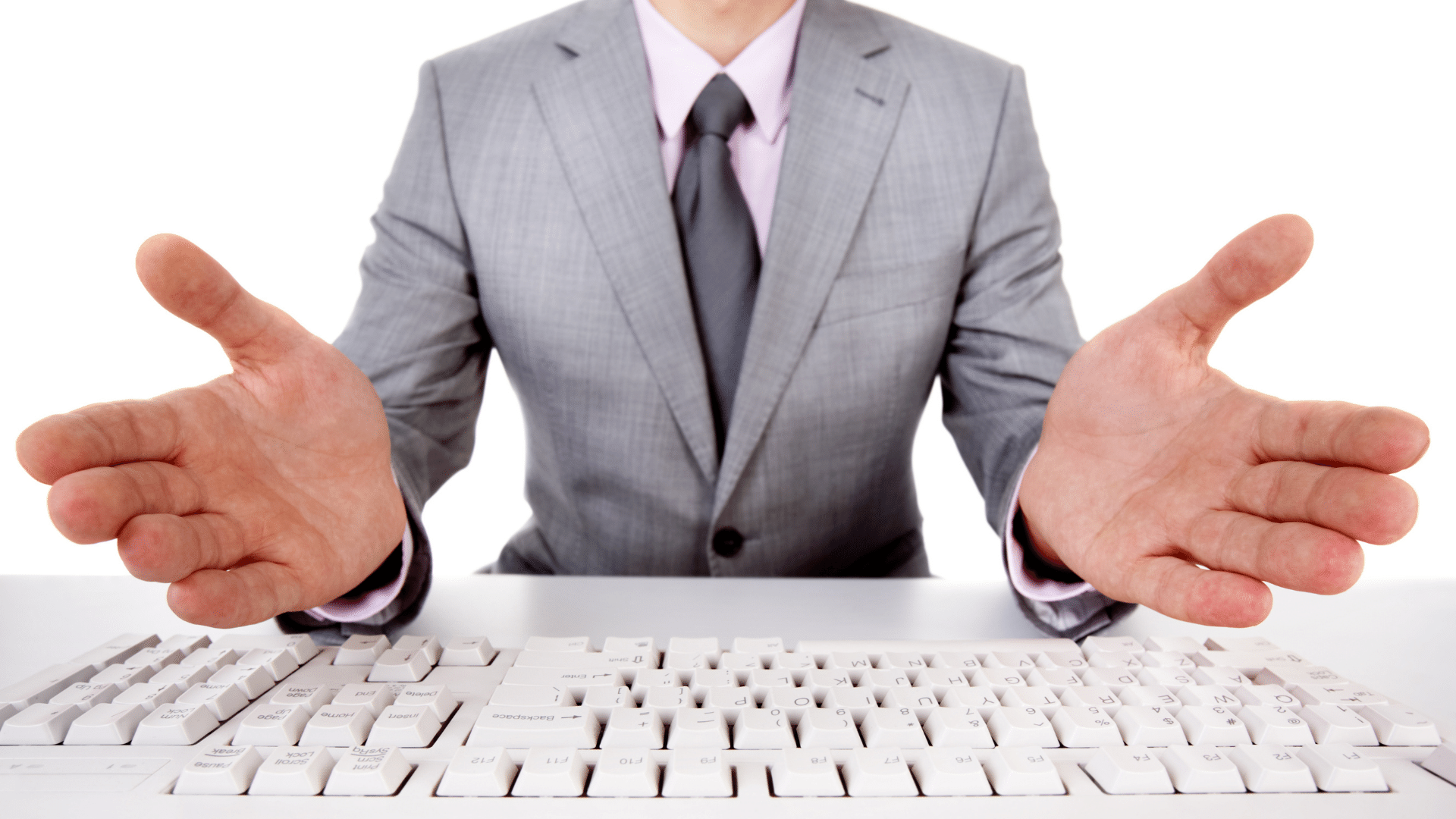 Person with hands open over keyboard. 