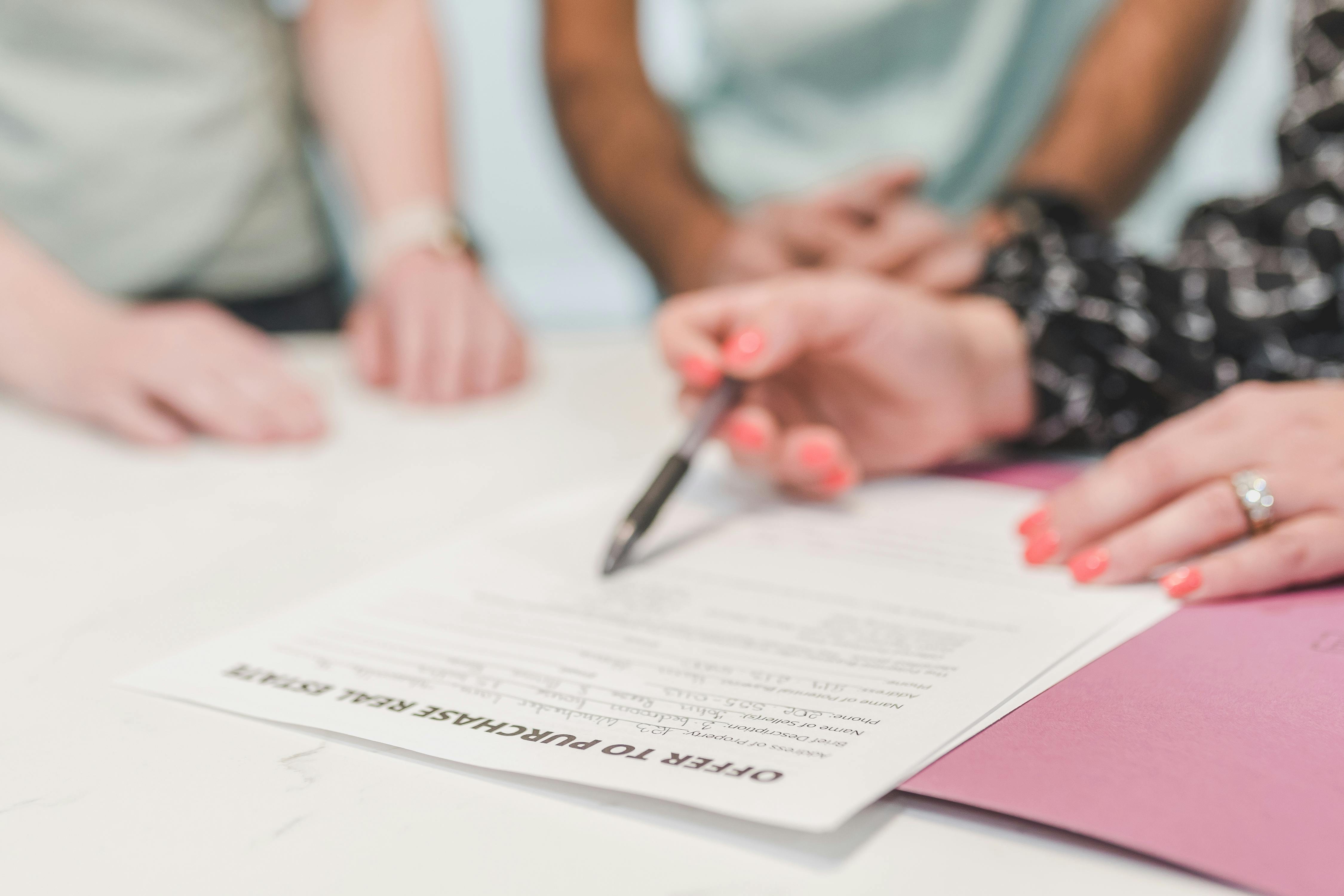 people looking at a contract