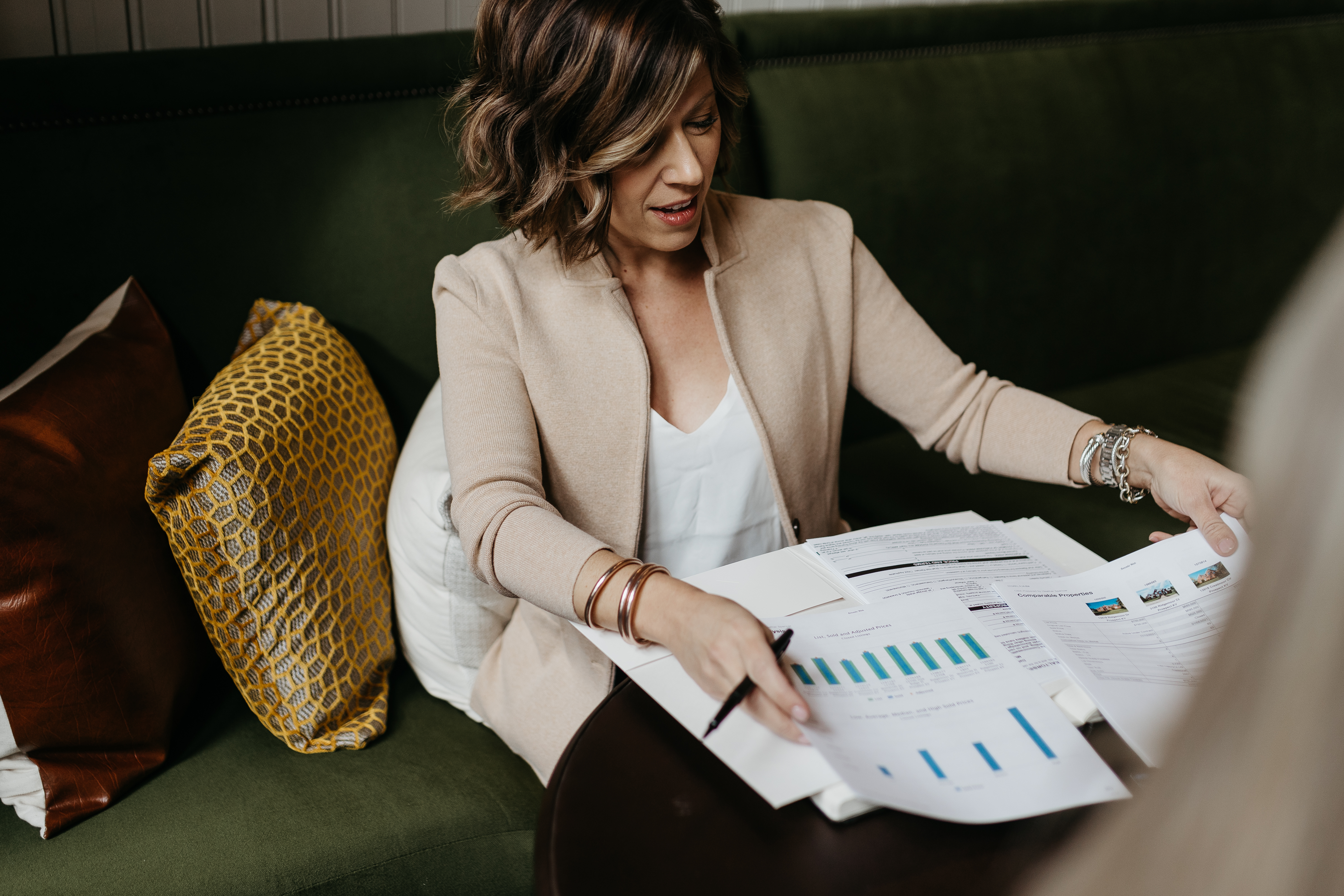 Louisville Realtor Heather Spencer reviewing market data and comparable properties for a listing appointment.