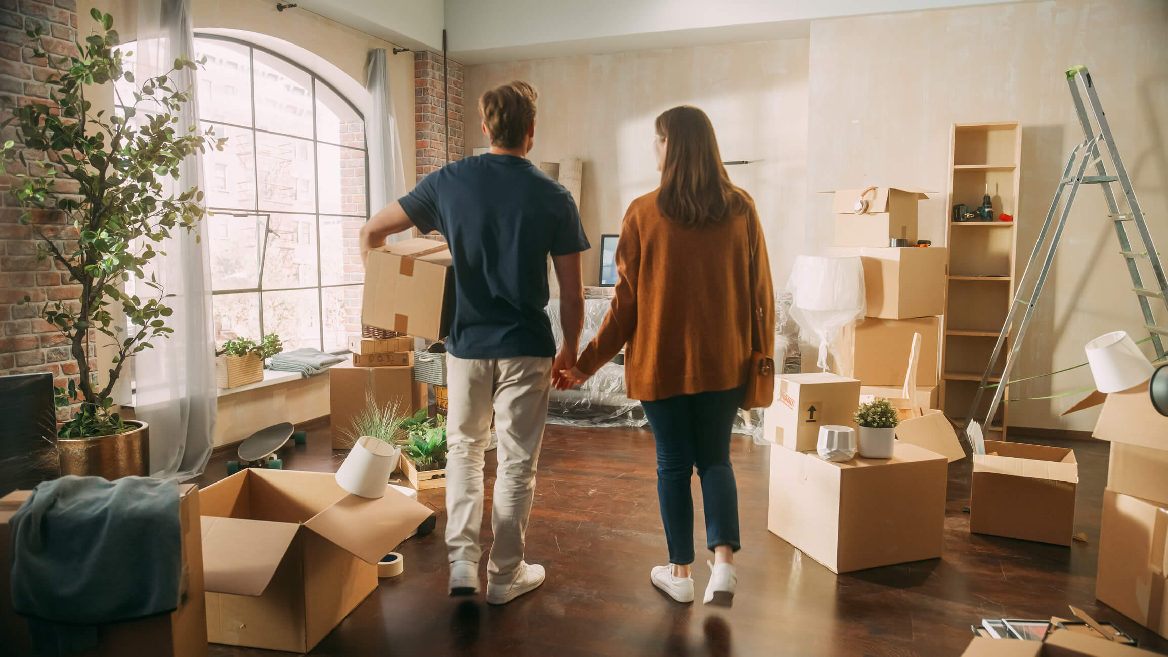 Young couple moving into new home