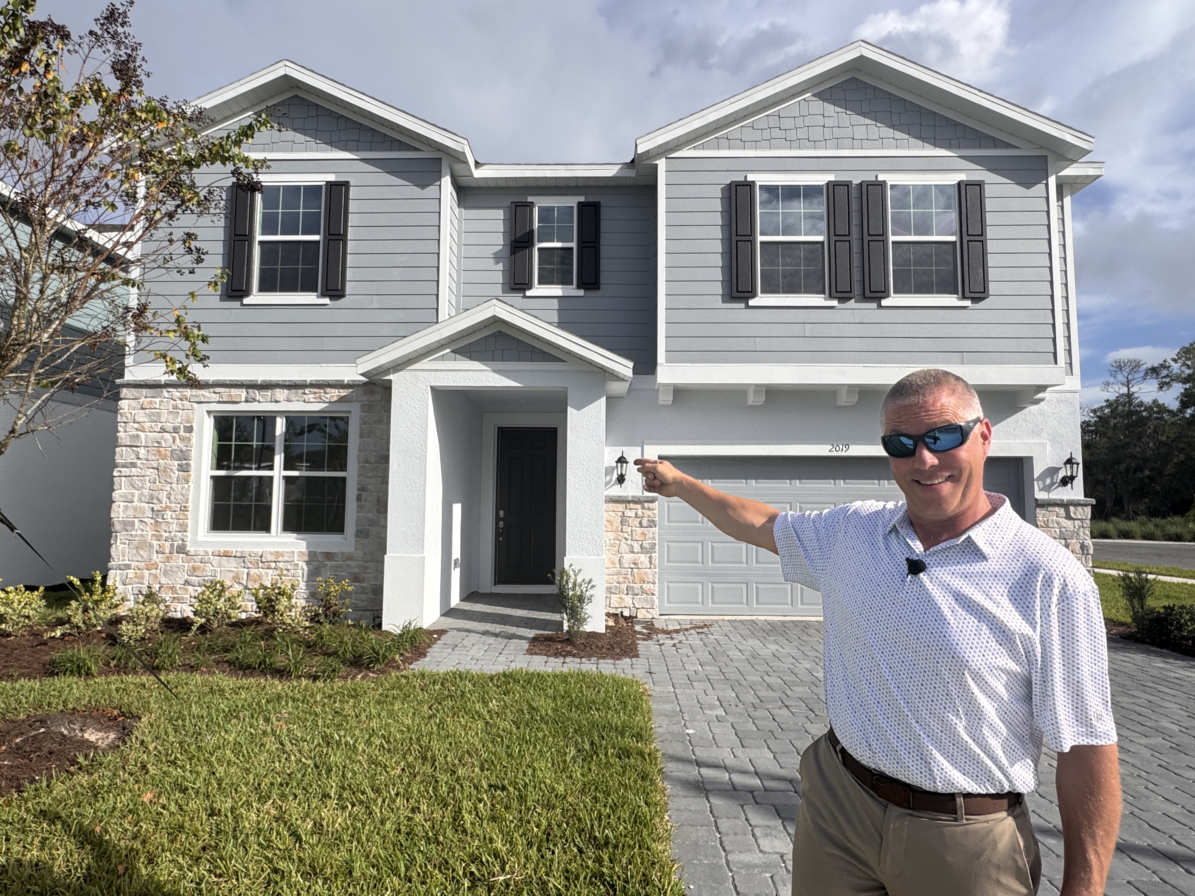Chuck in front of a DeLand home