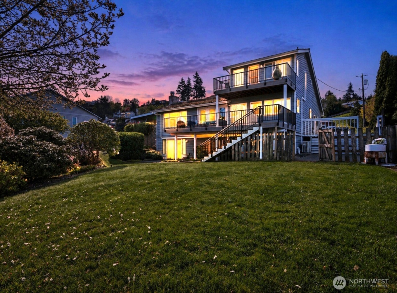 Views That Steal the Show: A Light-Filled Edgewater Home Overlooking the Sound and Olympics header image.