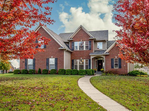 Missouri home surrounded by colorful fall foliage