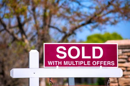 Sold sign with multiple offers showing competitive housing market and quick home sales