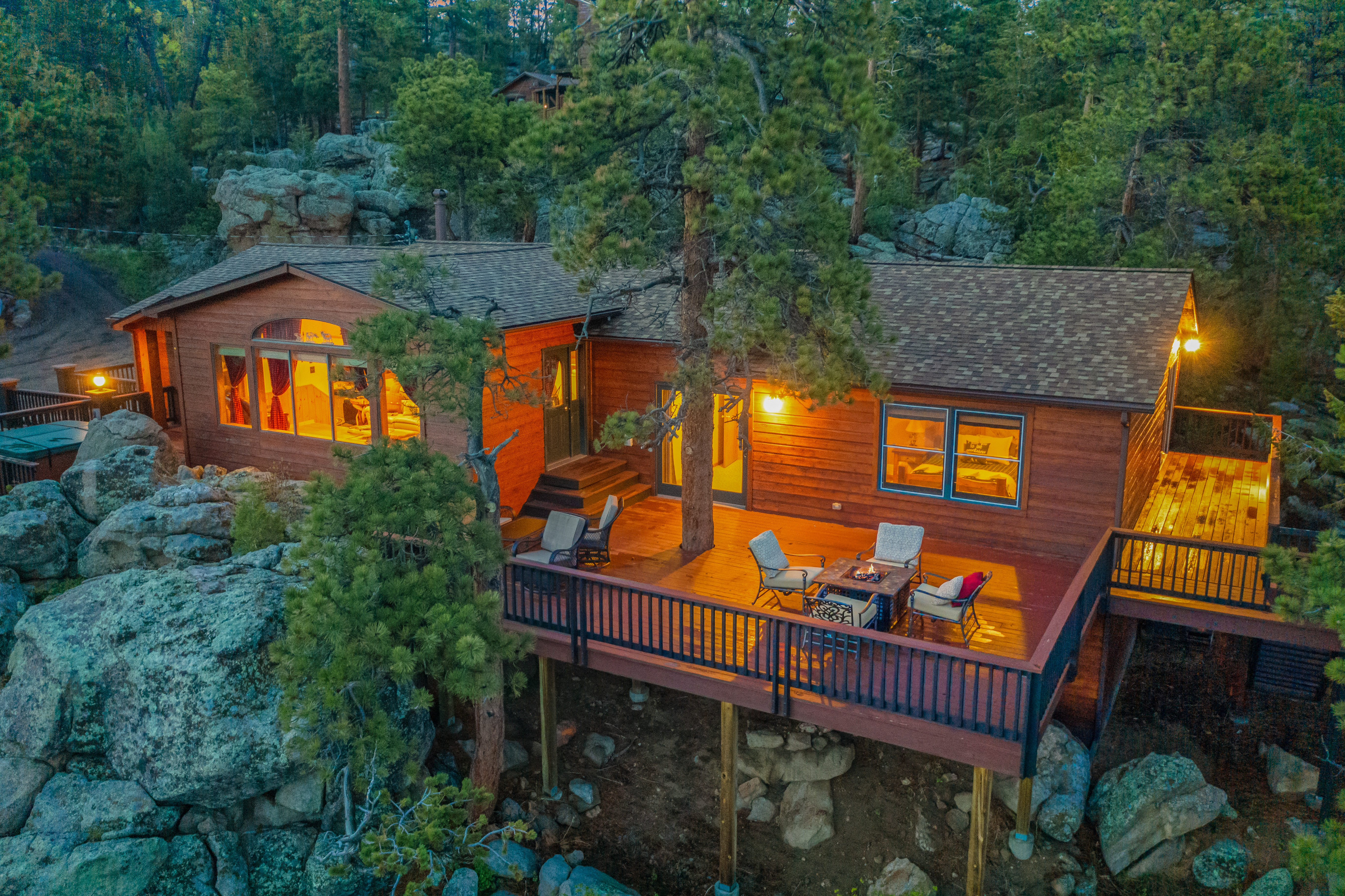 Mountain home in Estes Park Colorado with a backdrop of pine forest and peaks