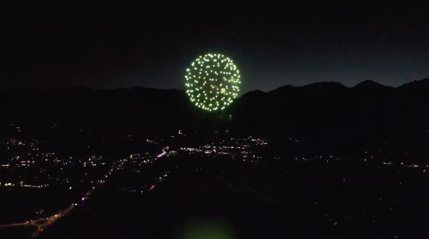 Fourth of July fireworks bursting over Lake Estes with the mountains behind, Estes Park, Colorado